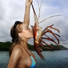 Girl kissing lobster