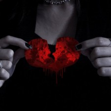 Woman holding broken heart