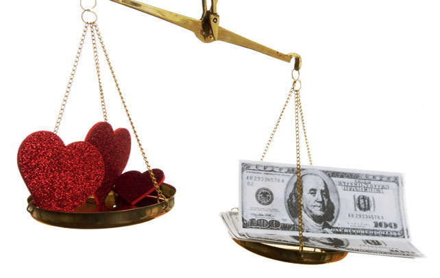 Scales balancing hearts and money