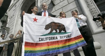 People holding California flag with rainbow