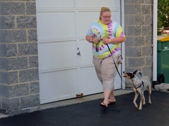 Woman walking dog on leash