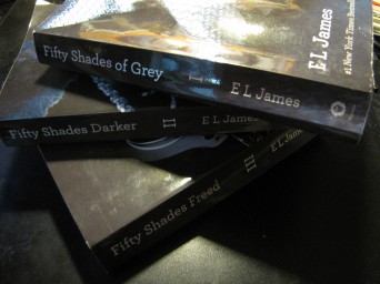 Three copies of Fifty Shades of Grey stacked