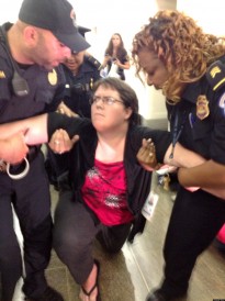 Police arrest LGBT protester during sit in