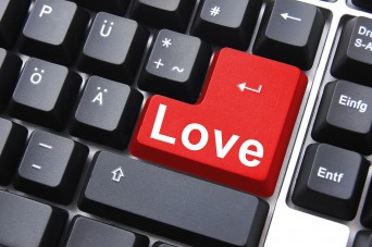 Computer keyboard with love on the enter key