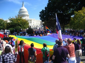 LGBT rally with large rainbow flag in front of US Capitol