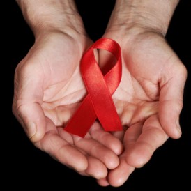 Hands holding AIDS ribbon