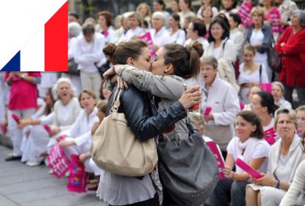 Girls kissing in defiance of anti-gay protestors