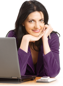 Woman on computer and smiling