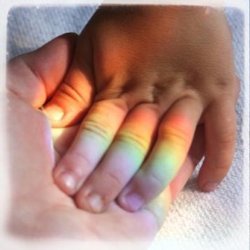 Rainbow family holding hands