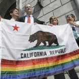 People holding California flag with rainbow