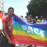 Cuban gay activists holding a rainbow sign