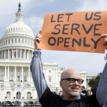 Protester holds "Let us serve openly" sign near US Capitol building