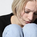 Woman holding her head.