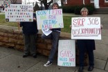 ENDA activists with signs