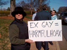 Protester with Ex-gay is a hoax sign