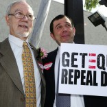 Same-sex couple with Repeal DOMA sign