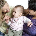 Two women with a baby