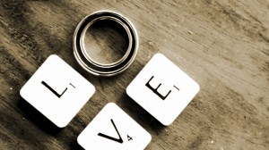 Love in Scrabble tiles with rings