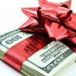 Money wrapped in a red bow
