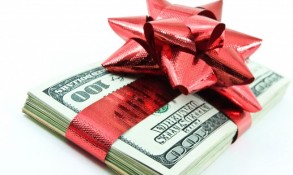 Money wrapped in a red bow