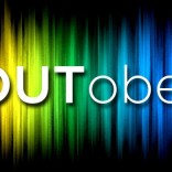 Outober sign with rainbow background
