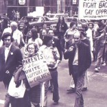 Iconic photo of PFLAG founder Jeanne Manford and her son Morty in 1970s NYC gay rights parade.