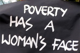 Poverty has a woman's face sign