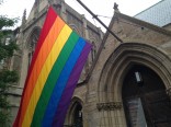 Pride flag in front of church