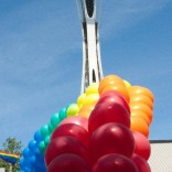 Seattle Space Needle with rainbow balloons