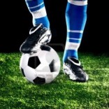 Soccer ball with player foot