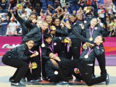 USA basketball women's national team poses with gold medals