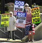 Westboro Baptist Church members with signs
