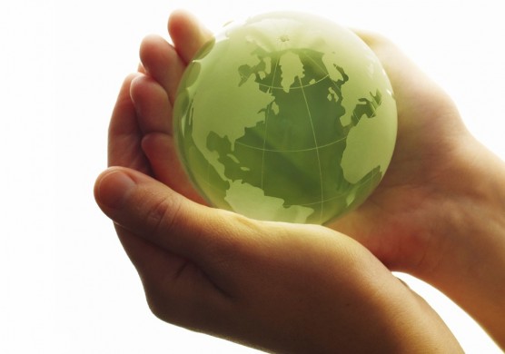 Woman holding green globe
