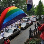 Woman waving LGBT flag