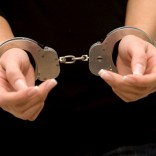 Woman's hands in handcuffs