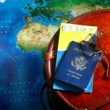 Map, passport and backpack for world travel