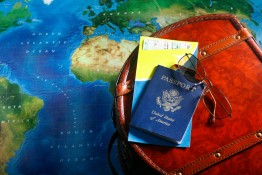 Map, passport and backpack for world travel