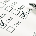 Close up of yes and no checkboxes with pen