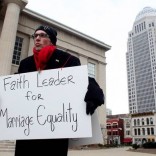 Bojangles Blanchard holding marriage equality sign.