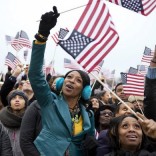 People waving flags at inauguration.