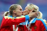 Gold medalist Tatyana Firova and Kseniya Ryzhova of Russia kiss in Moscow. (Photo: Paul Gilham/Getty Images)