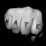 Hate tattoo on fingers