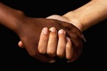 Interracial women holding hands