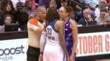 WNBA stars on court kiss