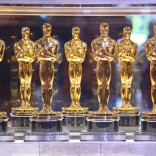 A collection of Oscar statuettes for the Academy Awards.