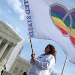 Marriage equality protester with rainbow flag outside US Supreme Court