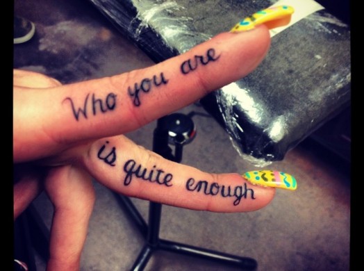 who you are is quite enough tattoo on fingers